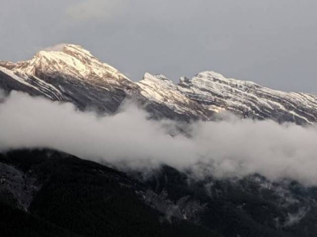 Sun rays on snow capped peaks (View from Gondola)